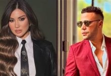 صورة النجم محمد إمام يضم النجمة هدي الاتربي لأسرة مسرحية برنس العالم